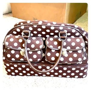 Small brown polka dot carry on